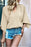 Parchment Solid Color Crinkled V Neck Bell Sleeve Blouse